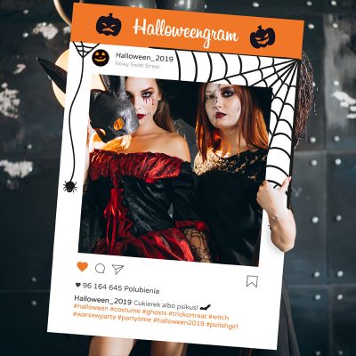 Two girls in halloween costumes in studio